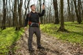 Man hiker taking photo with smart phone in forest Royalty Free Stock Photo