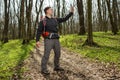 Man hiker taking photo with smart phone in forest Royalty Free Stock Photo