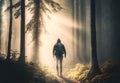 Man hiker walking into the bright rays of light in a misty forest to meet the sun, generated ai Royalty Free Stock Photo