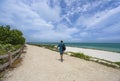 Man hiker walking to the beach.