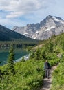 Man Hikes Next to Lake Josephine