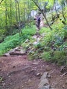 Man hikes steep stone steps up Poke O Moonshine Trail Royalty Free Stock Photo