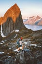 Man hiking alone in Norway mountains travel with backpack outdoor active vacations healthy lifestyle extreme sports Royalty Free Stock Photo