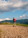 Man hiking with backpack Carpathian Mountains on scenic view Travel Lifestyle wanderlust adventure outdoor into the wild Royalty Free Stock Photo