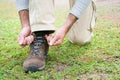 Man hiking doing the knot shoes Royalty Free Stock Photo