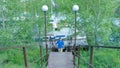 Man hiking in the forest as he climbs on the stair - travel and hiking. A man going up the stairs Royalty Free Stock Photo