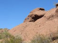 Man hiking on the Hole-In-The-Rock formation in Arizona Royalty Free Stock Photo