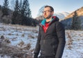 Man hiking on mountain with Hardshell during winter