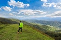 Man hiking at mountains with heavy backpack Travel Lifestyle wanderlust adventure concept summer vacations outdoor alone into the Royalty Free Stock Photo