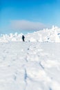 Man hiking in the mountains on snowshoes in snow winter Finland