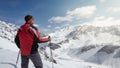 Climber looking at a snowy mountain landscape in a sunny winter day. Royalty Free Stock Photo