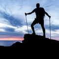 Man hiking silhouette in mountains, ocean and sunset