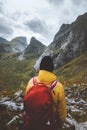 Man hiking solo enjoying mountains landscape travel in Norway outdoor adventure