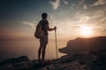 Man hiking at sunset mountains with heavy backpack Royalty Free Stock Photo