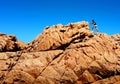 Man hiking up spectacular rocks.