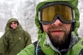 Man is hiking in winter forest on cloudy day Royalty Free Stock Photo