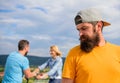 Man hipster feels lonely couple dating behind him. Unlucky romantic life. Guy adult still lonely while friends happy