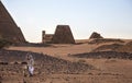Man with his camel in a desert in Sudan Royalty Free Stock Photo