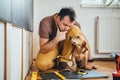Man and his dog doing renovation work at home Royalty Free Stock Photo