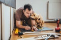 Man and his dog doing renovation work at home Royalty Free Stock Photo