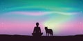 Man and his dog enjoy the beautiful aurora borealis in starry sky