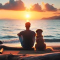 A man with his dog sitting on the beach against the background of the sunset. Royalty Free Stock Photo