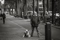 Man and his dog, street portrait, similar posture