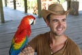Man and his domesticated parrot Royalty Free Stock Photo