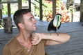 Man and his domesticated toucan bird Royalty Free Stock Photo