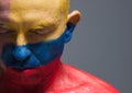 Man and his face painted with the flag of Colombia. Royalty Free Stock Photo