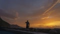 Man and His Faithful Companion Enjoy a Serene Sunset Walk Along the Shore Royalty Free Stock Photo