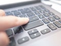 Man by his finger almost has pressed button on keyboard