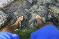 Man with his foots on the water Royalty Free Stock Photo