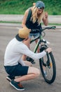 Man with his hands dirt of grease is fixing a bike Royalty Free Stock Photo