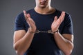 The man with his hands handcuffed in criminal concept