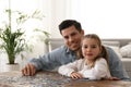 Man and his little daughter playing with puzzles at home Royalty Free Stock Photo