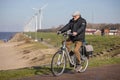 Man with his little son at bycycle near Dutch coast