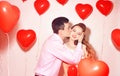 Man with his lovely sweetheart girl kiss at Lover`s valentine day. Valentine Couple. Couple kiss and hug. On background red Royalty Free Stock Photo