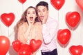 Man with his lovely sweetheart girl shocked . Lover`s valentine day. Valentine Couple. Couple surprised, very happy, discounts Royalty Free Stock Photo