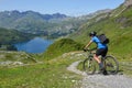 Man on his mountain bike going down the path from Jochpass over Engelberg in the Swiss Alps Royalty Free Stock Photo