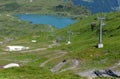 Man on his mountain bike going down the path from Jochpass over Engelberg in the Swiss Alps Royalty Free Stock Photo