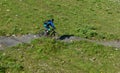 Man on his mountain bike going down the path from Jochpass over Engelberg in the Swiss Alps Royalty Free Stock Photo