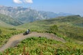 Man on his mountain bike going down the path from Jochpass Royalty Free Stock Photo