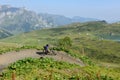 Man on his mountain bike going down the path from Jochpass Royalty Free Stock Photo