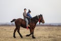 Man and his son are bareback riding an adorned horse before an Epiphany celebrati