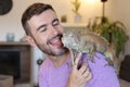 Man and his spectacular Iguana Royalty Free Stock Photo