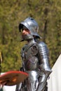 Man in historical costume (a knight) prepares for a battle. Royalty Free Stock Photo