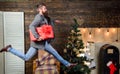 Man hold box hurry to deliver gift on time. Spread happiness and joy. Bearded guy in motion jump. Delivery christmas Royalty Free Stock Photo