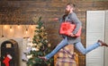 Man hold box hurry to deliver gift on time. Spread happiness and joy. Bearded guy in motion jump. Delivery christmas Royalty Free Stock Photo