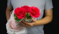 man hold bunch of red rose flower in two hand Royalty Free Stock Photo